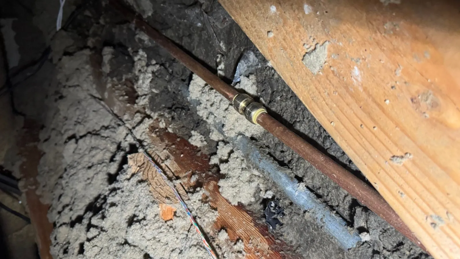 Burbank crawl space water line before repair – leaking copper section inside framing cavity