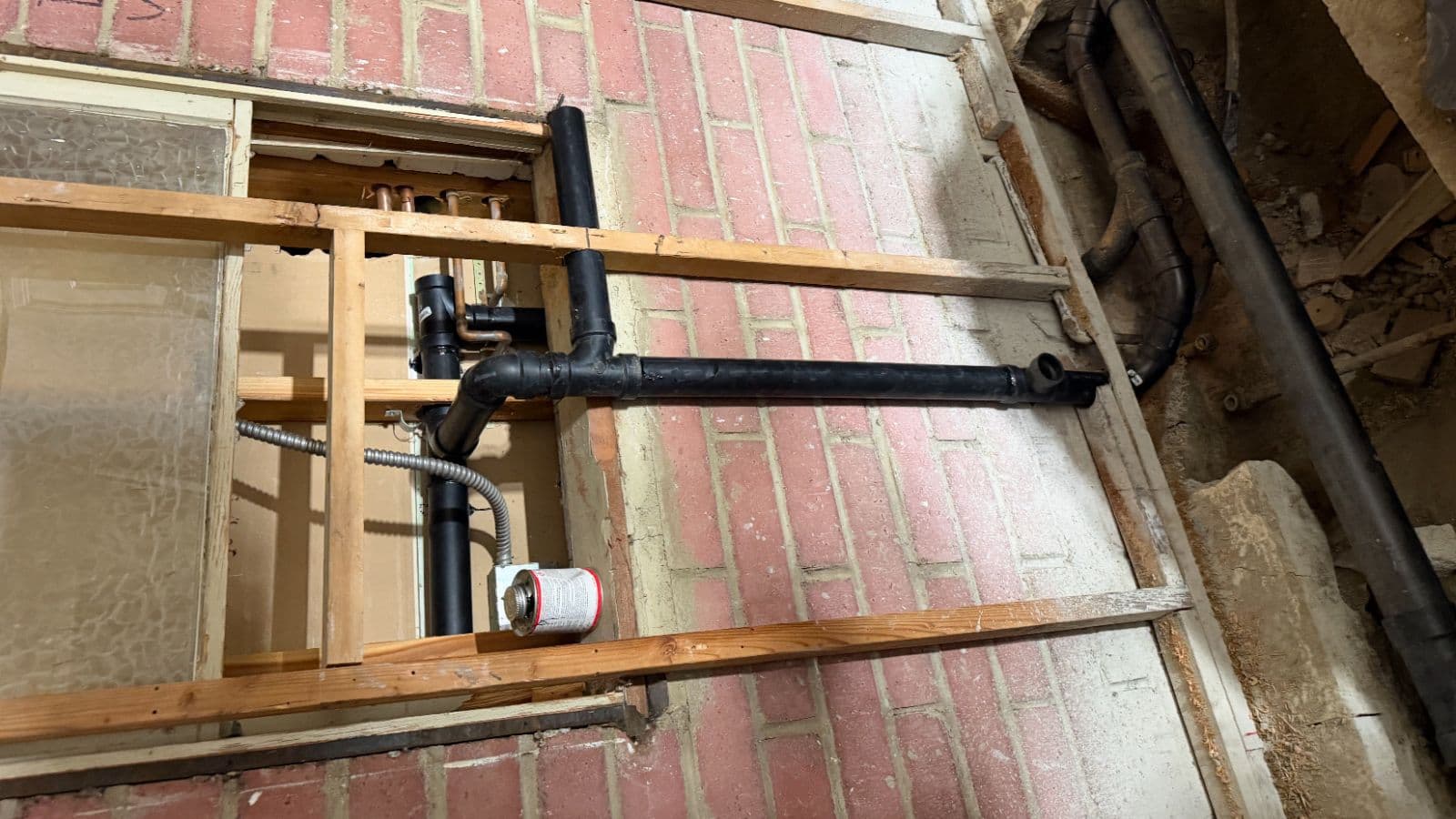 Glendale bathroom rough-in during room conversion – exposed wall showing new drain and vent piping