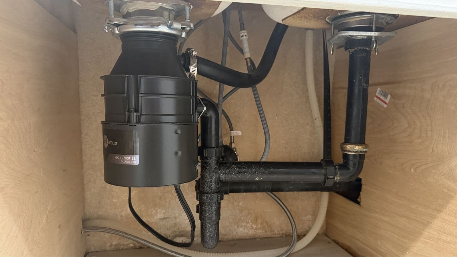 New InSinkErator garbage disposal installed with corrected P-trap and properly graded branch drain line in Glendale near Glenoaks