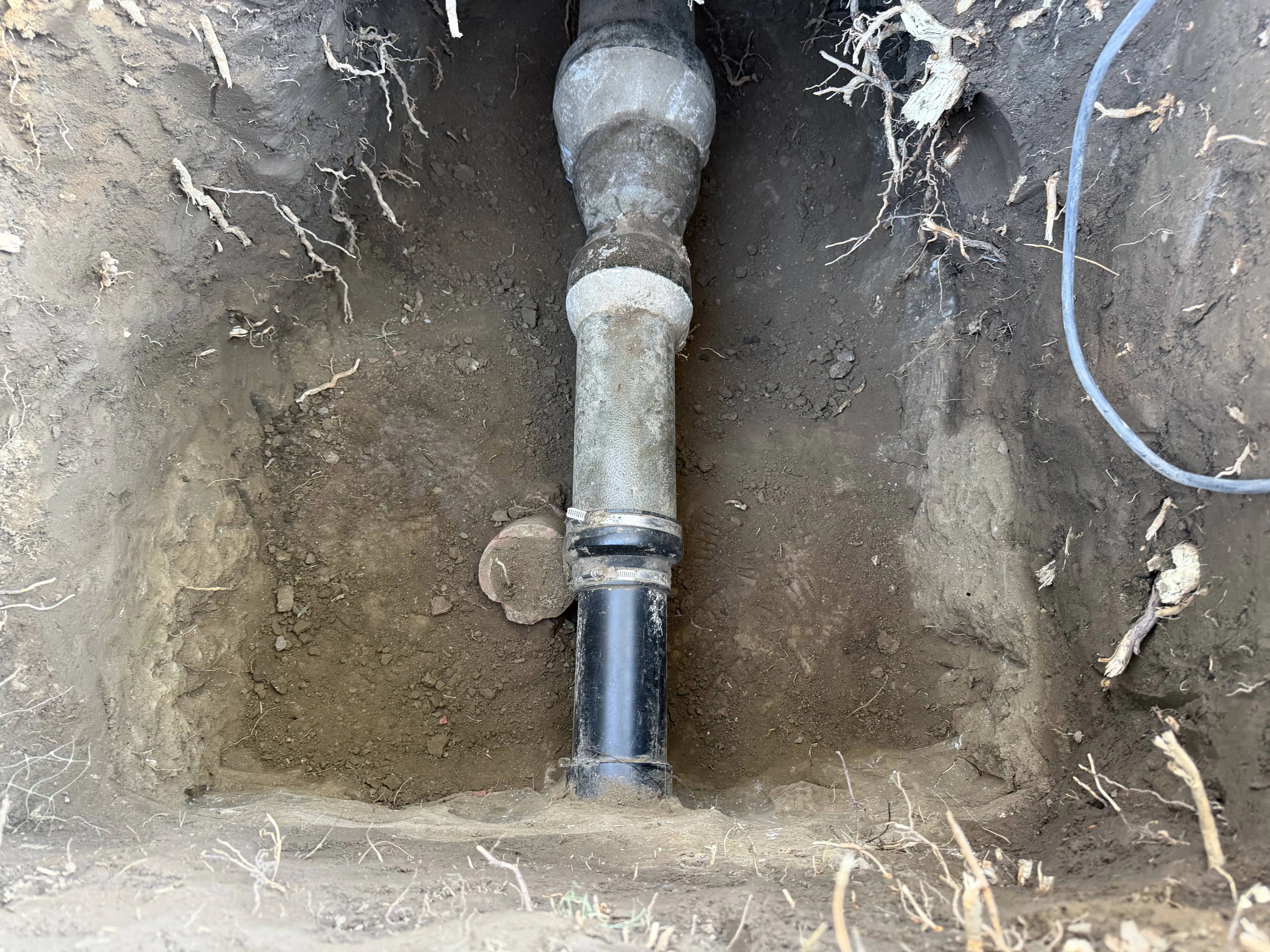 Failed clay to ABS sewer line transition before repair in Glendale