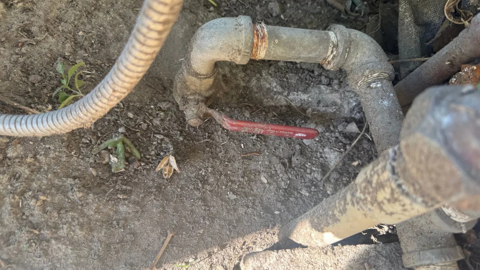Glendale water line before repair – meter box showing failing fittings