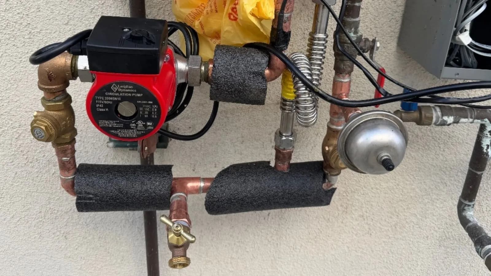 Hot water recirculation pump installation with insulated copper piping in Tujunga