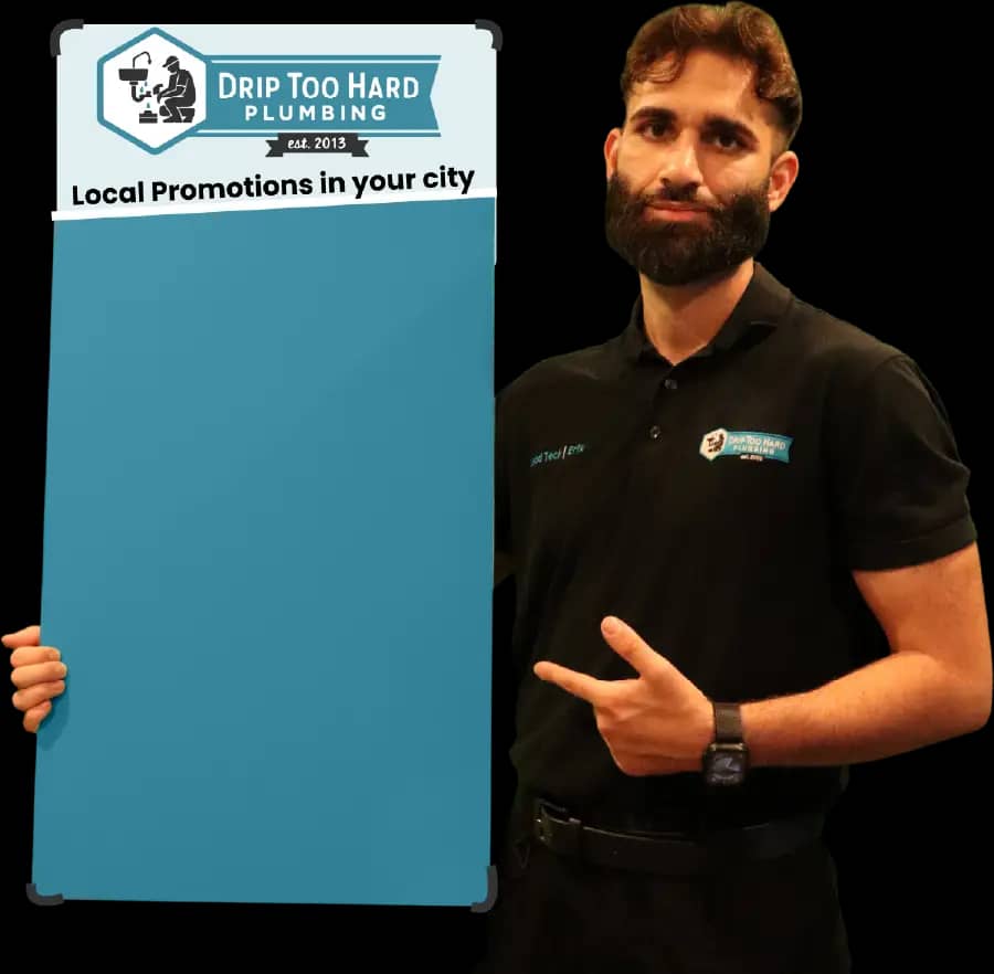 Plumber holding service area promo boards