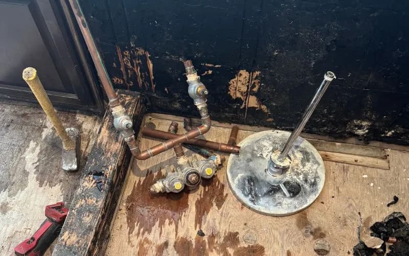 Before: old shower valve and trim in a Burbank bathroom with aging components impacted by hard water and years of use.