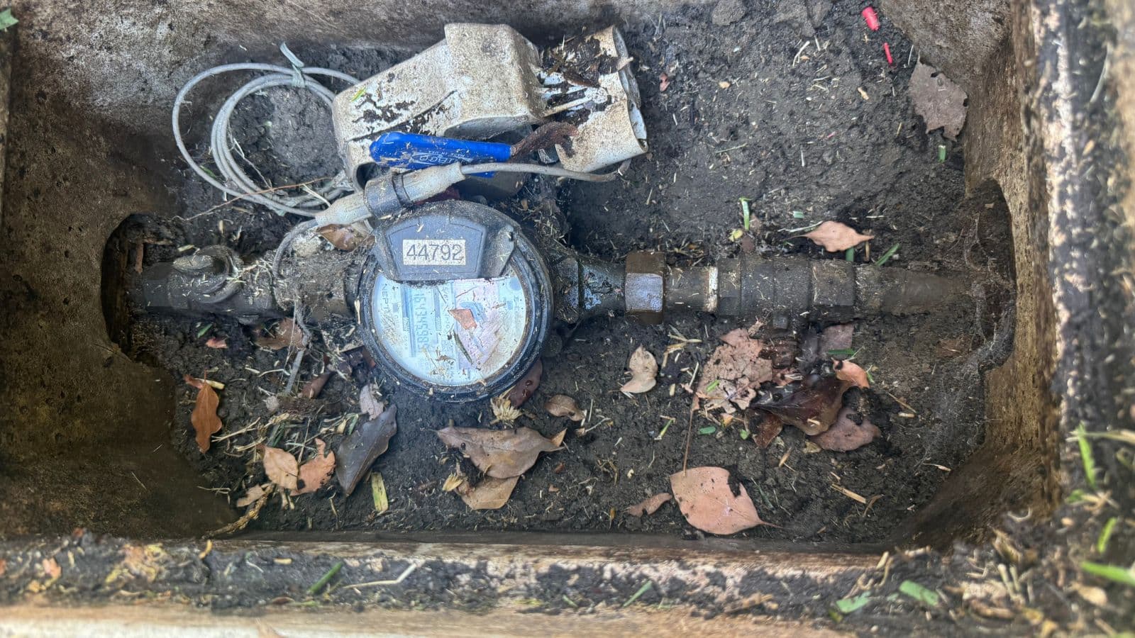 Burbank water line before repair – exposed corroded shutoff and damaged piping