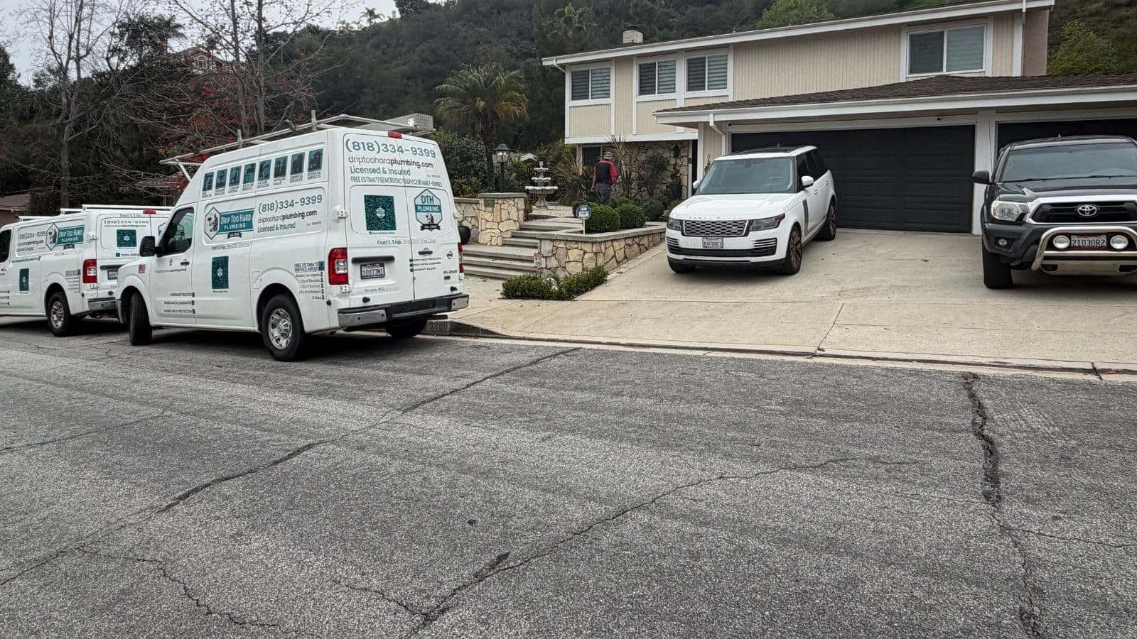 Drip Too Hard Plumbing vans at Emerald Island new construction project